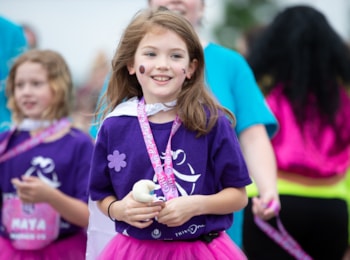 Two Girls on the Run participant both smile with an arm around each other